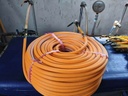 Rollo de manguera de fumigación 100 mts amarilla.